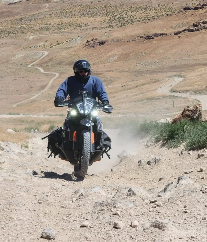 A student at Bret Tkacs Idaho ADV camp riding up a steep hill.