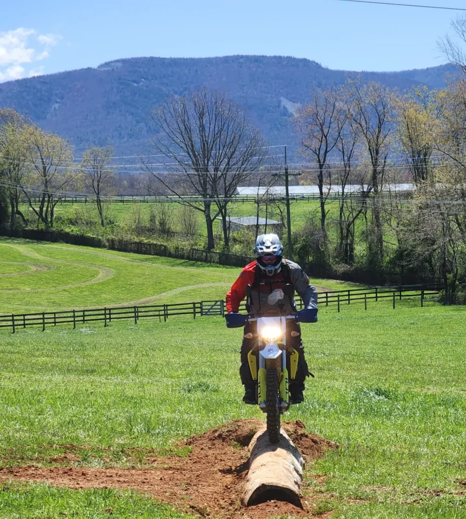 Rider balancing on a log in the Virginia Challenge training with Bret Tkacs